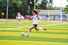 Julia Bernard, a Panther junior, sent a shot to the midfield to protect her team’s backline during the match versus Belle Fourche Photo by Peterman Sports Photography • stevepeterman5@gmail.com