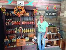 Wendy Simpson stands inside Simpson Spice Shop on her rural Elk Point property, where she sells homemade canned goods, spices, seasonings and produce grown on the farm. Simpson is opening the shop after years of selling at farmers markets. Photo by Shannon Jost • timesleader1@gmail.com