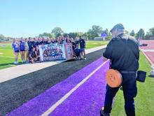 Freelance photographer Steve Peterman, a longtime photography contractor for the Leader-Courier and Dakota Dunes/North Sioux City Times, photographs the 2026 Dakota Valley girls soccer team after the Panthers punched their ticket to the Class A state tournament. Peterman began photography in 1997 and has provided freelance photography since 2002, making him a familiar face along Siouxland sidelines for more than two decades. Photo by Kelly Riibe • times2reporter@gmail.com