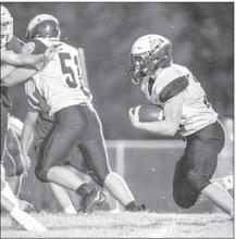 Ben Swatek completes the two-point conversion to end the game Aug. 19 against Parker. Photo by Peterman Sports Photography photoman@iw.net