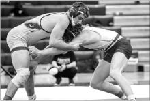Ben Swatek, pictured here at an earlier meet, took 1st place in the Region 2B meet in Salem Feb. 18. He’s one of the eight Huskies that are advancing to the state tournament.