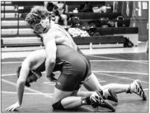 (Right) Noah McDermott had a 3rd place in the Husky Invite Dec. 17. He’s pictured here facing off with a Wagner opponent. Photo by Peterman Sports Photography stevepeterman5@gmail.com