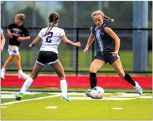 Addy Wubbena makes a move against a Belle Fourche player Aug. 27.  Photo by Peterman Sports Photography • photoman@iw.net