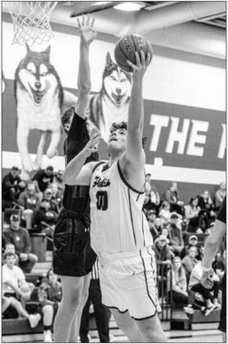 Chace Fornia goes up strong against a Sioux Falls Christian defender. He scored 14 points Dec. 14. Photo by Peterman Sports Photography stevepeterman5@gmail.com