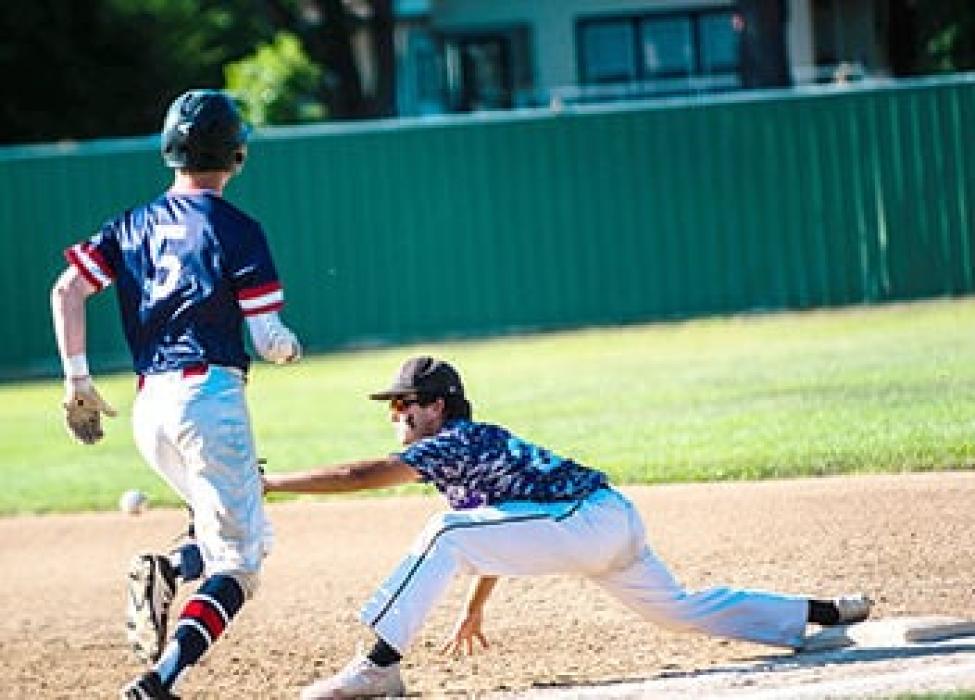 Brenden Barnett reaches for the ball to secure the out at first base against Vermillion.