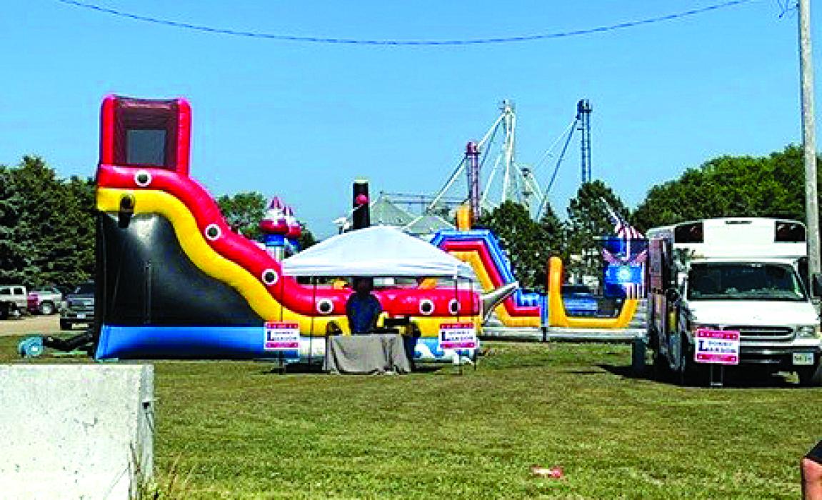 Multiple bouncy houses provide entertainment for children and teenagers. Submitted photo