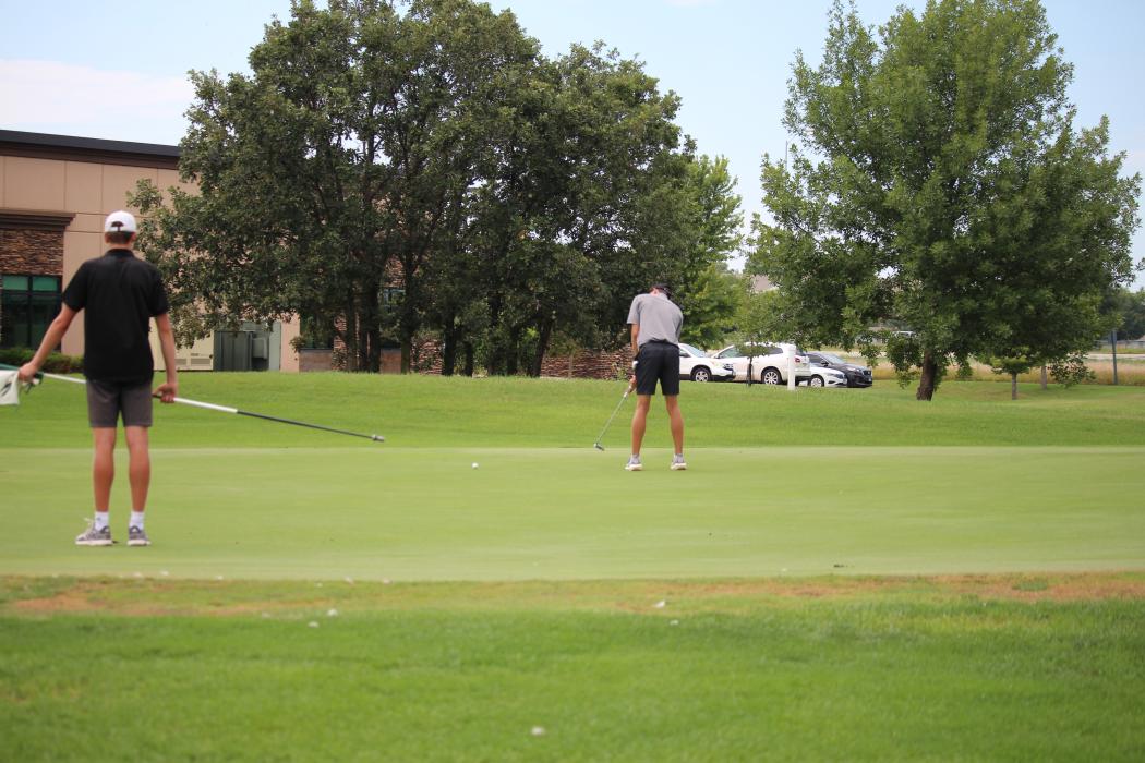 Logan Collette sinks a far putt at the Dakota Valley Invitational Aug. 24. Collette led the team with a 76 on the day.  Photo by Beth Sherard-Hutcheson • times1@iw.net