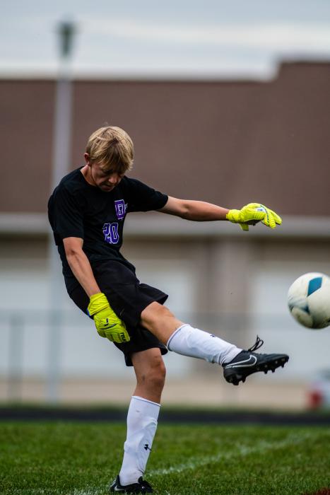 Reid Herbold kicks the ball away from the net to another Panther up the field. Photo by Peterman Sports Photography stevepeterman5@gmail.com