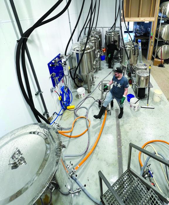 Behind the bar of Jefferson Beer Supply is a fully functional brewery where all their beer is made.  Submitted photo