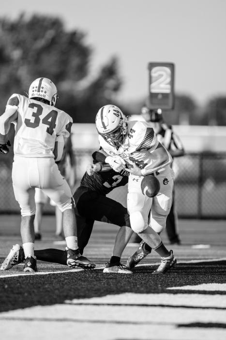 Trae Piel causes a fumble against Chamberlain Cubs leading to the second touchdown for the Panthers. Photo by Peterman Sports Photography • photoman@iw.net