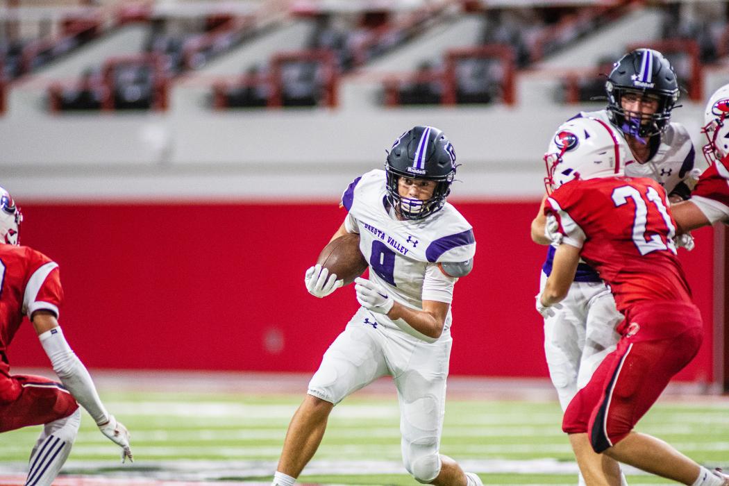 Tyler Schutte had a nice run after catching a pass from Ethan Anema during the game against Vermillion Aug. 26 in the DakotaDome. Photo by Peterman Sports Photography • photoman@iw.net