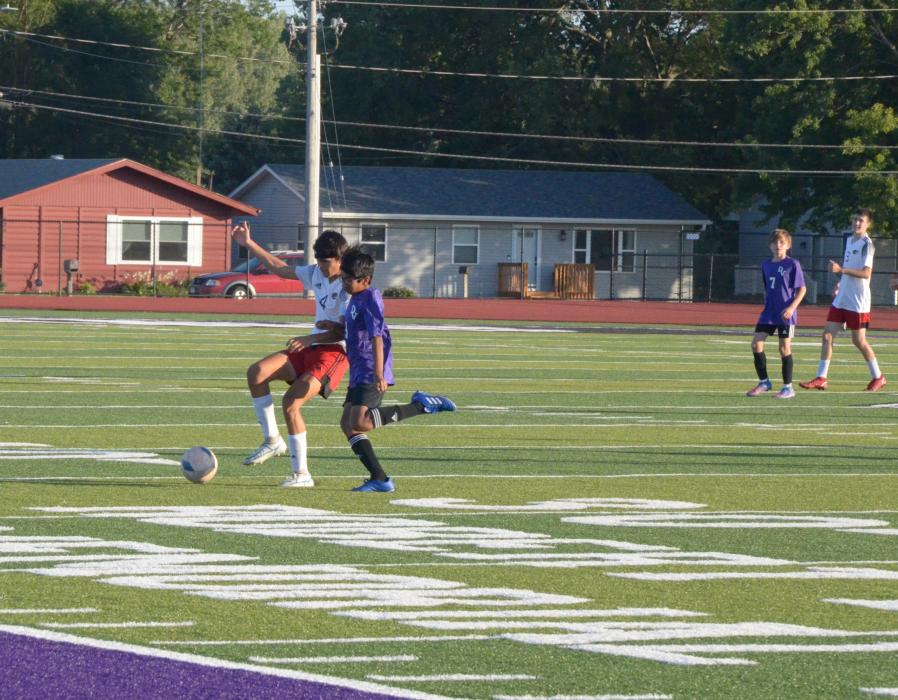 Yahya Luqman goes up against a Vermillion defender. Grace Meyer concentrates on passing the ball up the field. Photo by Peterman Sports Photography • photoman@iw.net Photo by Kelly Riibe • times2reporter@gmail.com