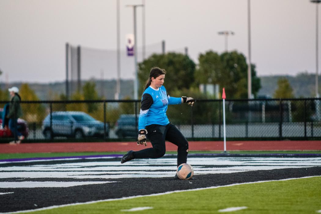 Jaelyn Bacan kicks the ball away from the goal after getting a save against Tea Area Sept. 27. Photo by Peterman Sports Photography • stevepeterman5@gmail.com
