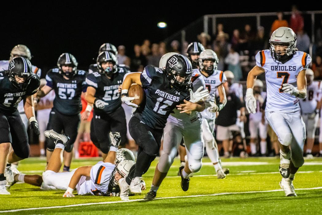 Jackson Boonstra breaks through the middle of the line for a big run. Photo by Peterman Sports Photography • stevepeterman5@gmail.com