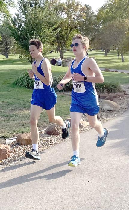 Carter Heckathorn and John Kjose run the course together finishing just seconds apart. Submitted photo