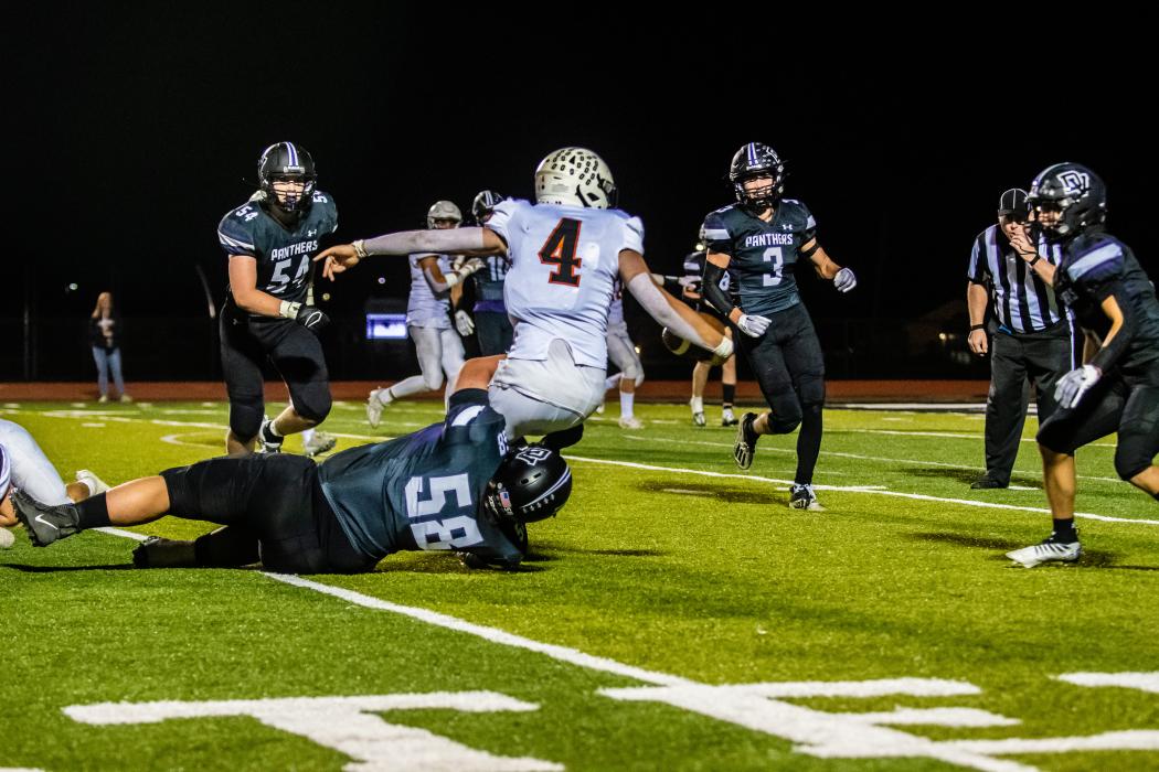 Connor Maltas sacks the quarterback. Photo by Peterman Sports Photography • stevepeterman5@gmail.com