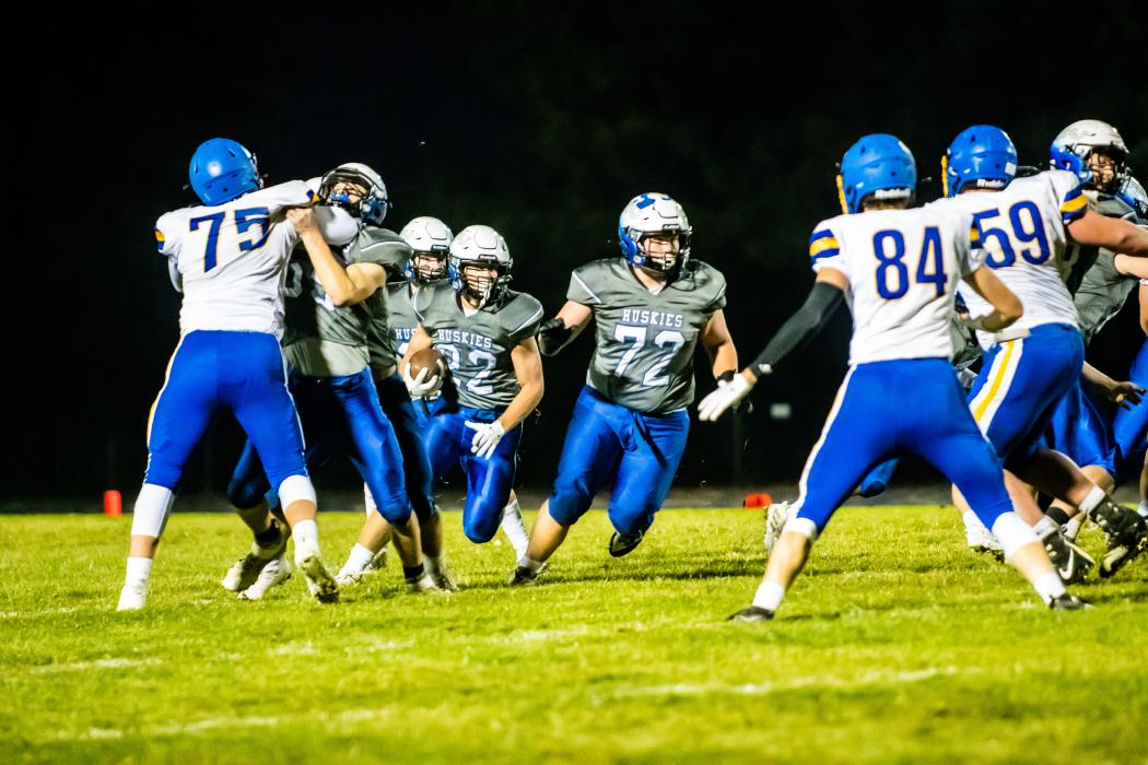 Ty Trometer blocks the way for Lucas Hueser to get closer to the endzone. Photo by Peterman Sports Photography stevepeterman5@gmail.com