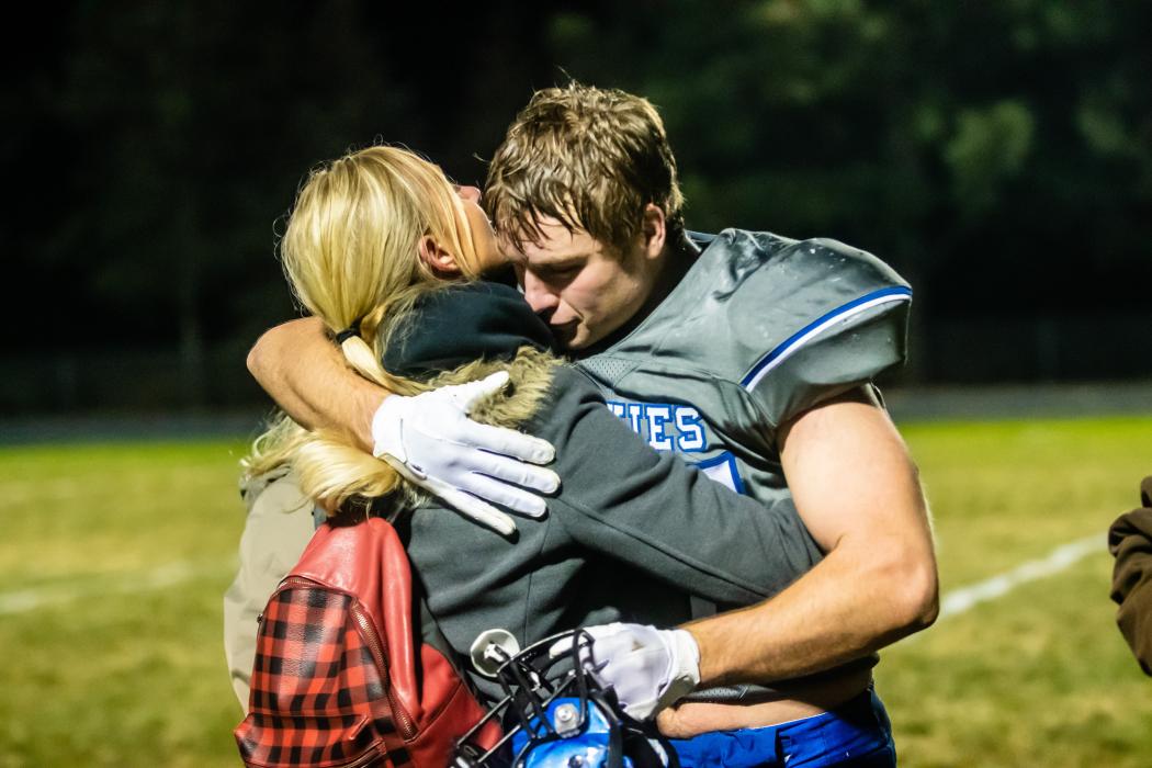 Ben Swatek hugs his mom after the game against Hot Springs Nov.4. Photo by Peterman Sports Photography stevepeterman5@gmail.com