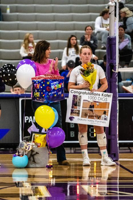 Kate VanRooyan was presented with gifts and flowers at senior night and was recognized for reaching 1,000 digs in her high school career. Photo by Peterman Sports Photography stevepeterman5@gmail.com