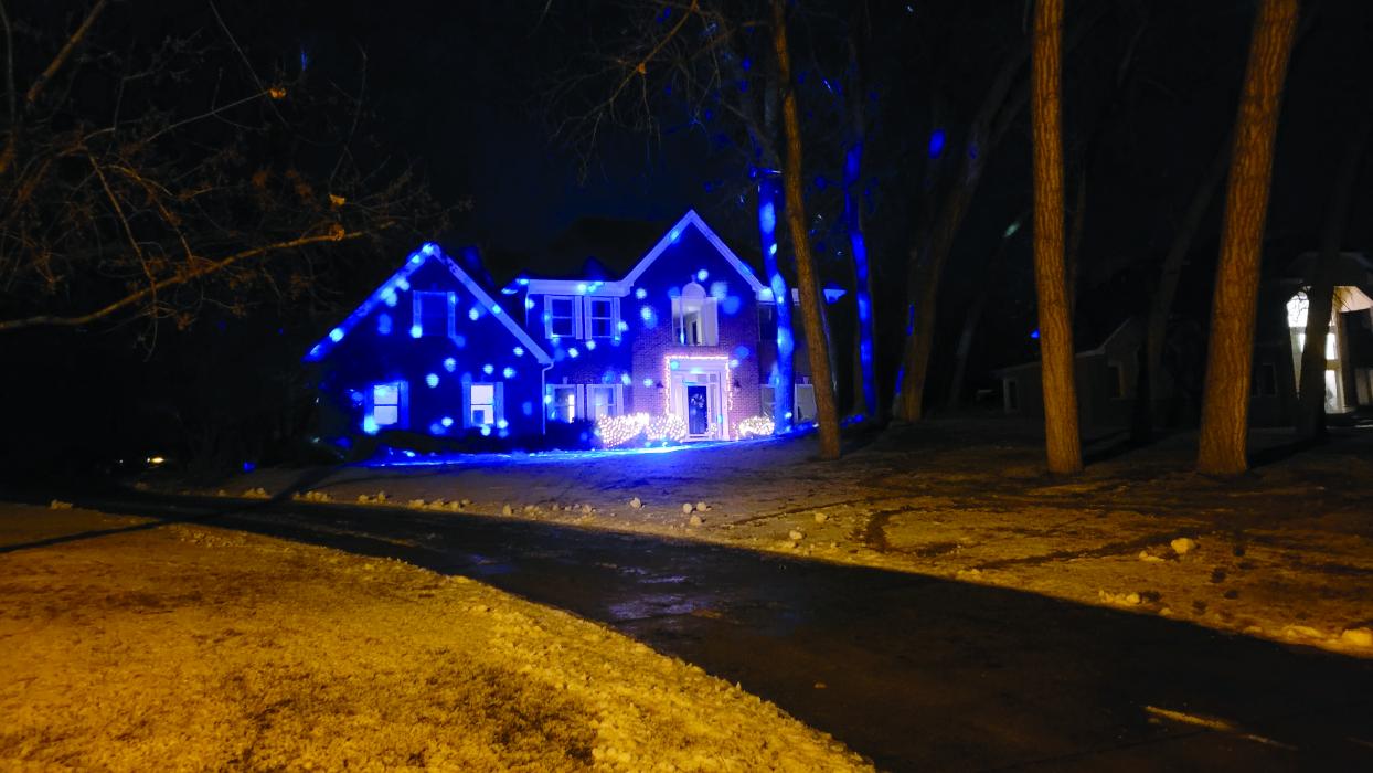 Changing laser of large holiday lights cascade on the Olsen’s home on West Sawgrass in Dakota Dunes. Photo by Kelly Riibe • times2reporter@gmail.com