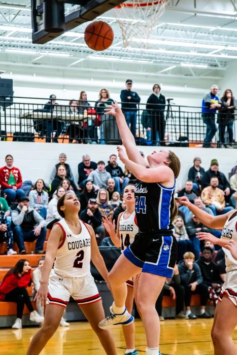 Josie Curry puts up a bunny against Viborg-Hurley Dec. 20. Photo by Peterman Sports Photography stevepeterman5@gmail.com