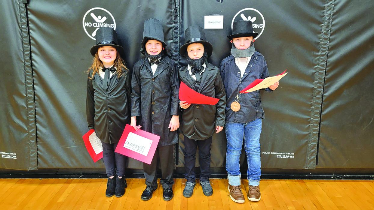 Four “Abraham Lincolns” were present at the DV Living History Timeline Nov. 22. They were, from left, Mia Jones, Jack Galles, Blake Tomcak and Jett Rosenbaum. Photo by Kelly Riibe • times2reporter@gmail.com