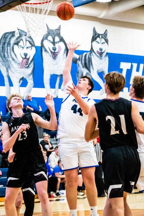 Easton Kempf was a force under the net, putting away 24 points to lead the Husky offense against Madison Dec. 10. Photo by Peterman Sports Photography stevepeterman5@gmail.com