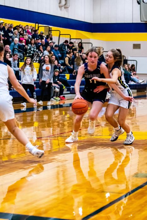 Addi Kleis attacks the basket against Tea Area.  Photo by Peterman Sports Photography stevepeterman5@gmail.com