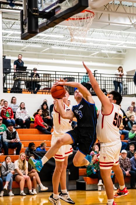 Garrett Merkley drives to the basket against Viborg-Hurley Dec. 20. Photo by Peterman Sports Photography stevepeterman5@gmail.com