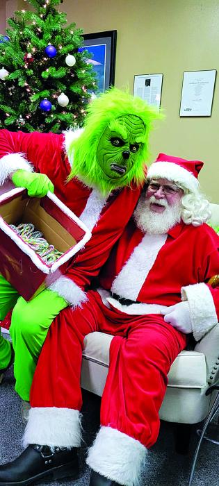 The Grinch and Santa worked together Dec. 3 for the sake of the children present. Submitted photo