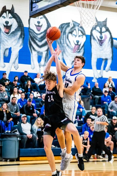 Jakob Scarmon goes up for the layup and draws the foul against Madison Dec. 10. Photo by Peterman Sports Photography stevepeterman5@gmail.com