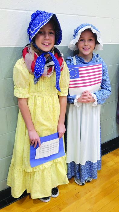 Zoe Clifford and Eva Bernard, third graders, were Betsy Ross for the “Living Timeline” at DVES on Nov. 22. Photo by Kelly Riibe • times 2reporter@gmail.com
