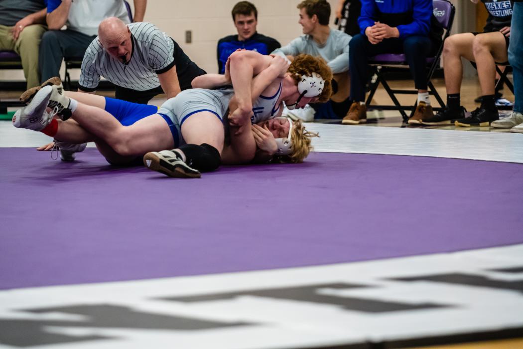 Noah McDermott (195 lbs) goes in for the pin against Gabe Gebhard of West Central at the Dakota Valley meet Jan. 10. Photo by Peterman Sports Photography stevepeterman5@gmail.com