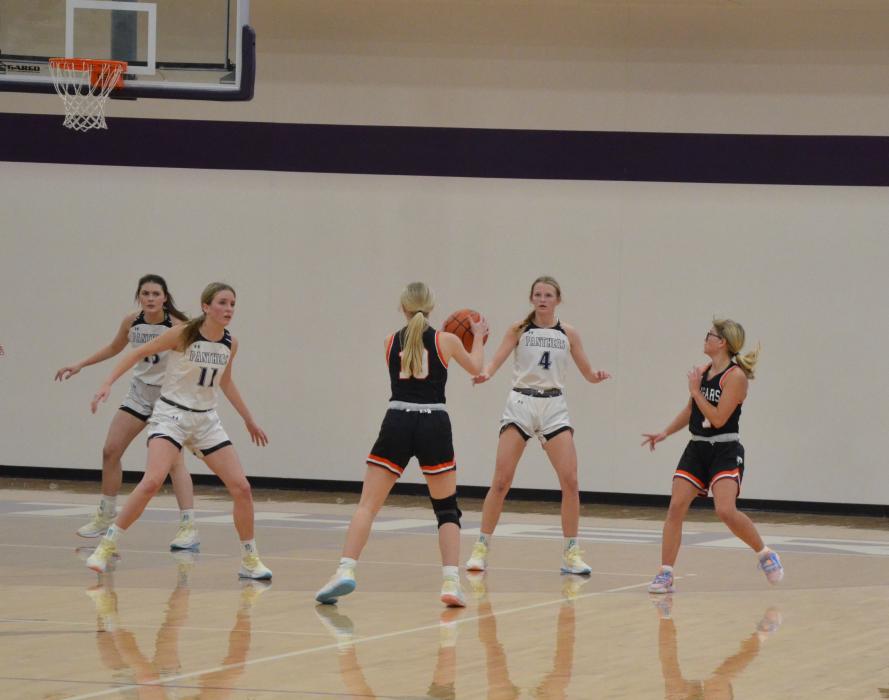 Cameryn Sommervold, Addie Kleis and Jorja VanDenHul keep an eye on the ball while on defense. Photo by Kelly Riibe • times2 reporter@gmail.com