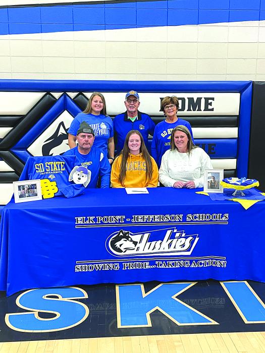 Josie Curry, middle, was surrounded by family, friends and teammates as she signed her national letter of intent to participate in Track at South Dakota State University. Pictured are, front from left, Andy Curry (father), Josie Curry and Melissa Curry (mother); and back, Kenna Curry(sister), Tom Curry (grandfather) and Patricia Curry (grandmother). Submitted photo