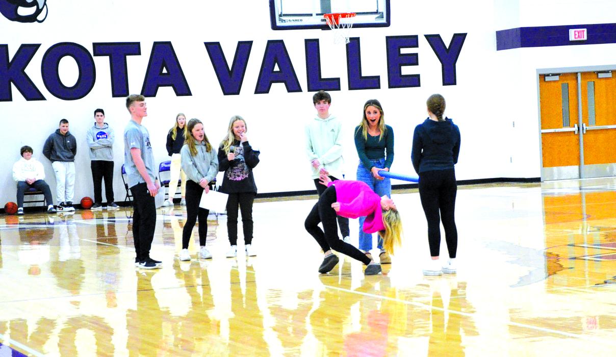 DVHS Student Council members watch freshman Josie Hall win the limbo contest at the pep rally on Jan. 9. Photo by Kelly Riibe • times2reporter@gmail.com