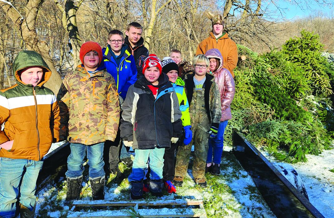 Scouts from Pack and Troop 28 combined to collect 35 Christmas trees from the surrounding area and dropped them off at Dorothy Pecaut so they may be repurposed into mulch in the Spring for Dorothy Pecaut’s trails. Pictured are, from left, Bentley Mahnke, Blake Winters, Aidan Hunt, Aden Garza, Tucker Winters, Carter Hunt, Logan Mahnke, Bretton Clark, Arianna Manke and Isaiah Dunbar-Hoffman. Submitted photo
