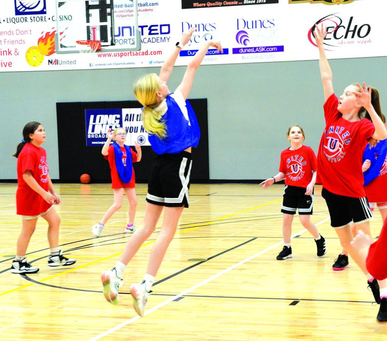 Reese Kleis, of Dakota Dunes, takes a shot while playing basketball at the Holiday Hoops camp on Dec. 29 at the United Sports Academy. Photo by Kelly Riibe • times2reporter@gmail.com