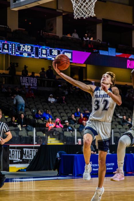Randy Rosenquist, shown playing against North Community, MN, had a great game against Chamberlain Dec. 30. He was recognized for a triple-double with 12 points, 11 rebounds and 16 assists. Photo by Peterman Sports Photography • stevepeterman5@gmail.com