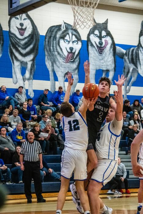 Isaac Bruns pushes his way to the basket in the game against Elk Point-Jefferson Feb. 2. He set the single game scoring record for 46 points in one game. Photo by Peterman Sports Photography stevepeterman5@gmail.com