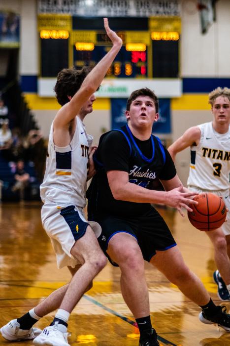 Easton Kempf pushes his way to the basket to get a total of 13 points against Tea Area Feb. 17. Photo by Peterman Sports Photography stevepeterman5@gmail.com
