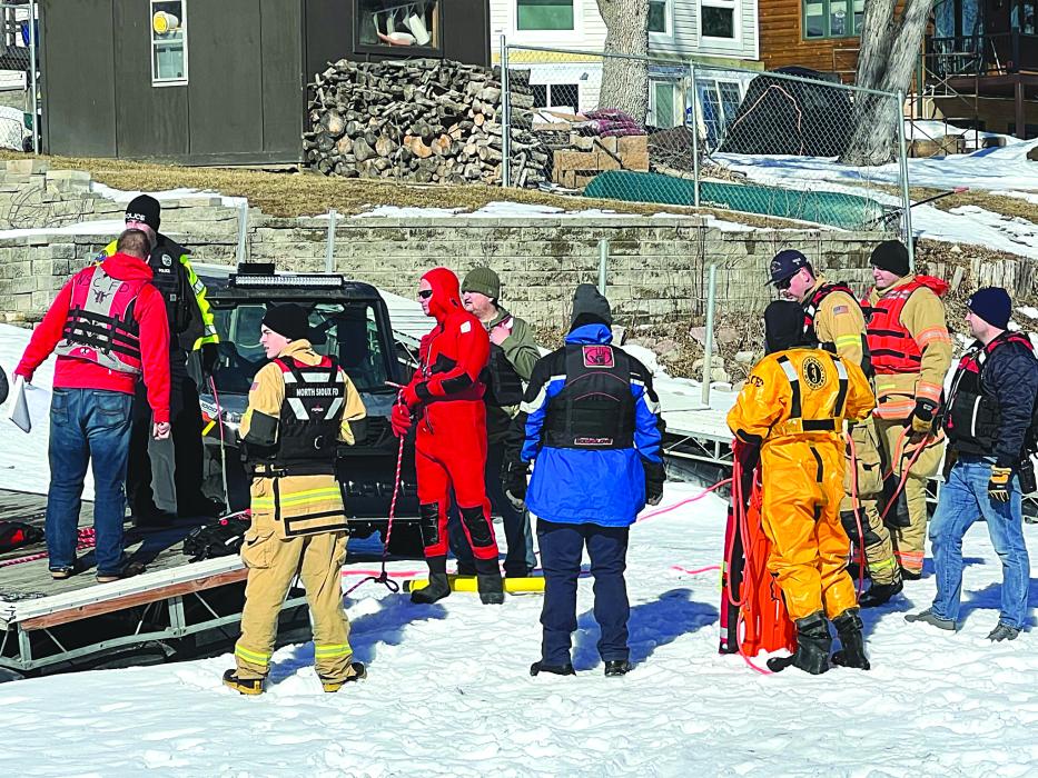 The North Sioux City Fire Department members gather to receive instructions on how the ice rescue training will go for the day.   Photo courtesy of Kevin Carlson, North Sioux City Fire Department