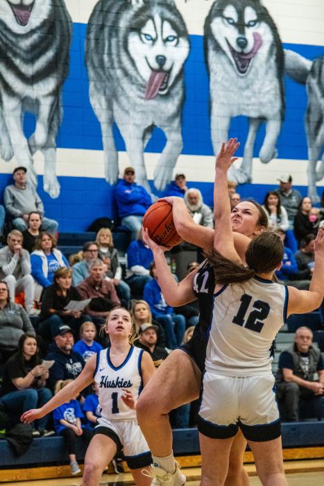 Ella Reifenrath fights her way to the basket Feb. 2 against Elk Point-Jefferson. Photo by Peterman Sports Photography stevepeterman5@gmail.com