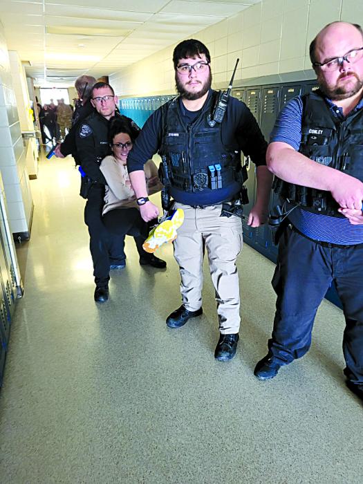 The Elk Point Police Department transports an “injured” patient to a secure location. Officers Corey Trudeau, Nick Fenske, Willis Strawn, IV and Neilson Conely more as a coordinated unit down the hallway. Photo courtesy of Union County Emergency Manager Jason Westcott