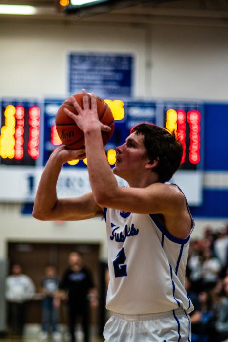 Devon Schmitz gets ready to let the ball fly toward the glass. Photos by Peterman Sports Photography • stevepeterman@gmail.com