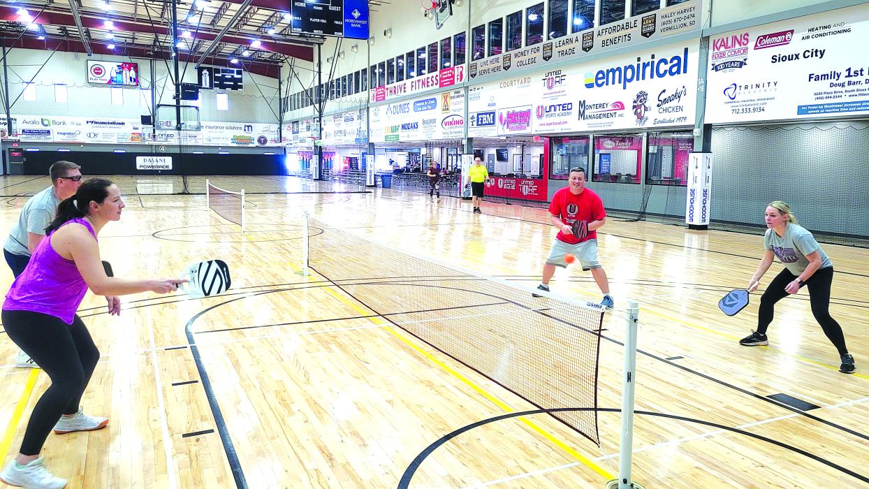 Stephanie Monk and Jim Daffer face off against Kyle Schute and Sherry Carreau in a friendly game of pickleball on Jan. 27 at United Sports Academy in North Sioux City. Photo by Kelly Riibe • times2reporter@gmail.com