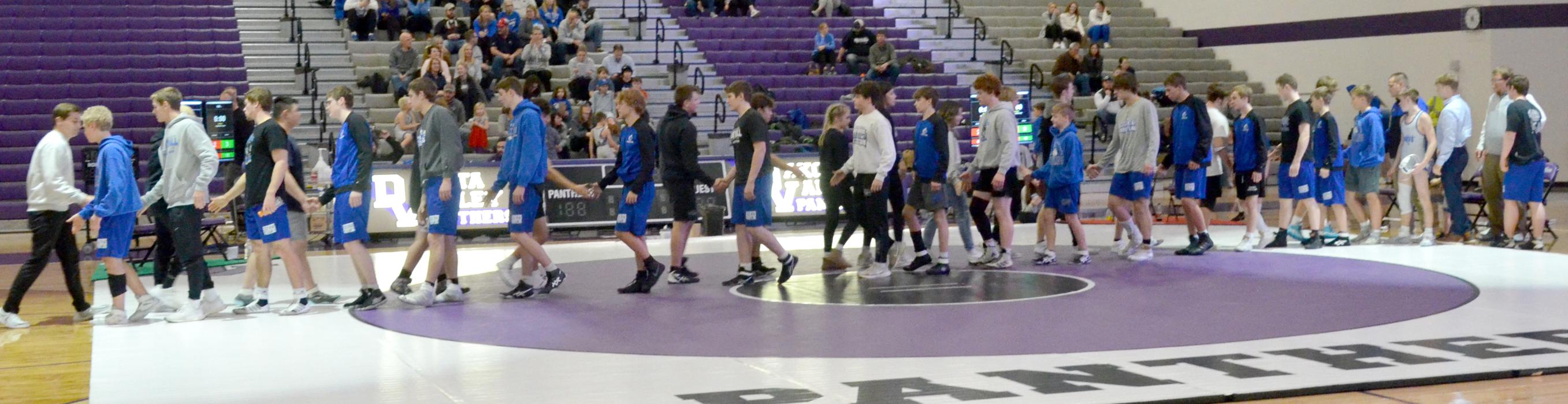 After all the wrestling matches were finished on Feb. 7, the Elk Point-Jefferson Huskies shook hands with Dakota Valley Panthers. Photo by Kelly Riibe • times2reporter@gmail.com