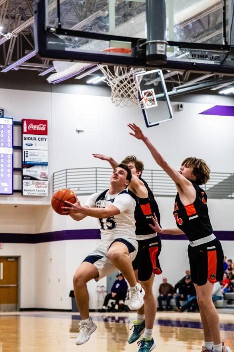 Senior Ethan Anema goes strongly to the basket against Lennox on Feb. 24. Photo by Peterman Sports Photography stevepeterman5@gmail.com