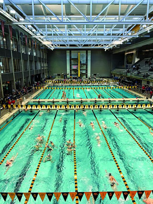 Swimmers take practice laps at the state swim meet in Iowa City. Submitted photo