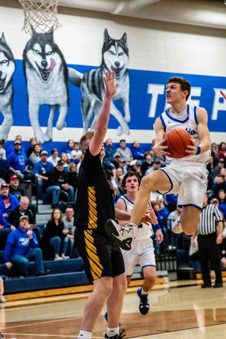 Alex Scarmon flys toward the hoop in the first round of regions against the Canton C-Hawks. Photo by Peterman Sports Photography stevepeterman5@gmail.com